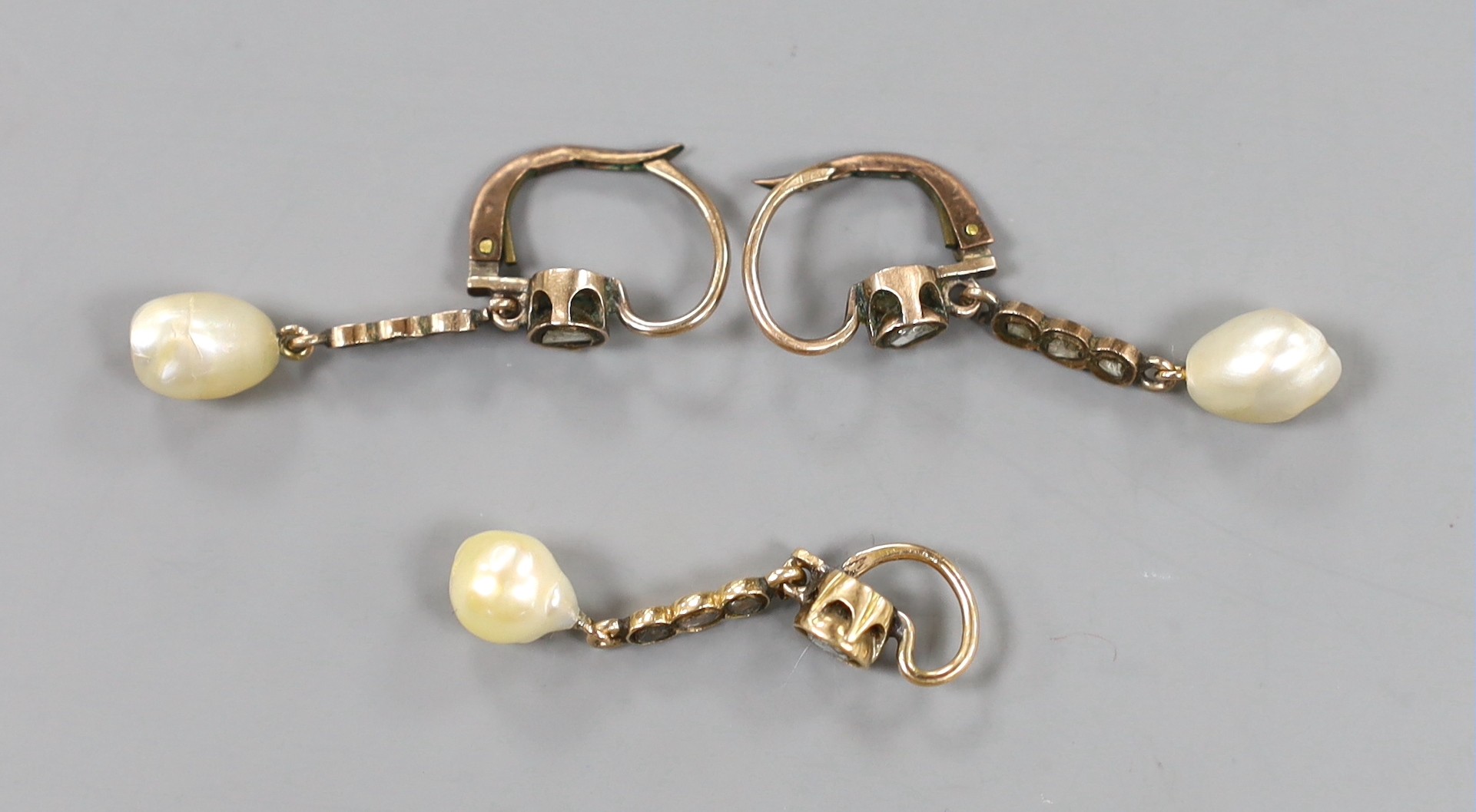A pair of yellow metal, baroque pearl and rose cut diamond set drop earrings, 38mm and a similar pendant, gross weight 5.9 grams.
